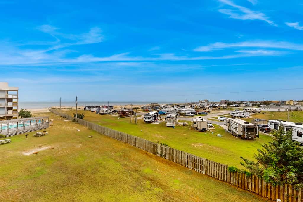 Ocean view condo with pool access, furnished balcony, & central AC
