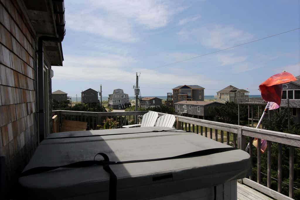 Fun home with ocean view, washer/dryer, outdoor pool access, and private hot tub