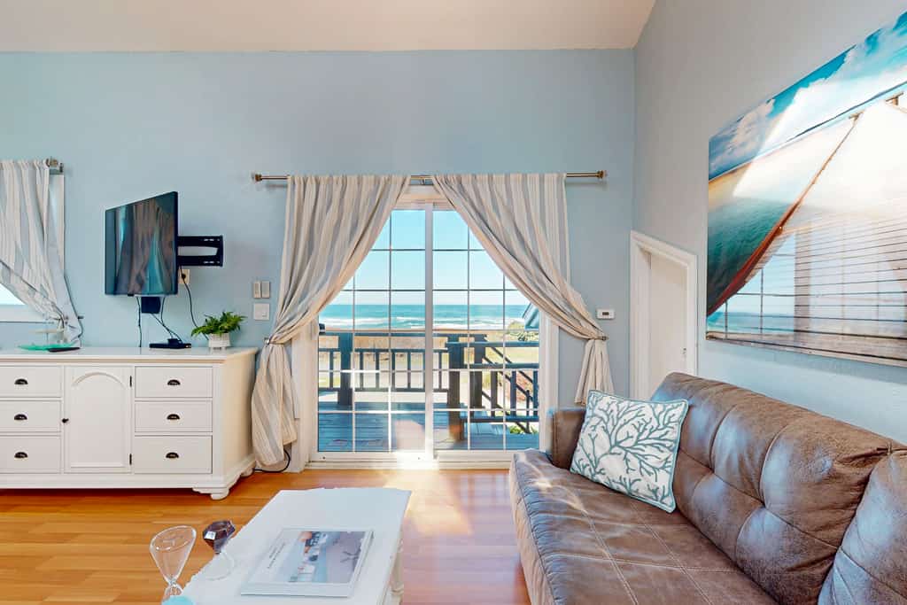 Sand Dollar Suite is an upstairs unit, attached to the main home. When arriving at the home, park on the right hand side of the driveway directly in front of the right side of the garage. Walk thru the gate on right side of home that says Sand Dollar. On your left will be a door with an e-lock, which is the entrance into the Sand Dollar suite. Once you are in the entryway, the right door leads up a flight of stairs into the Sand Dollar suite.