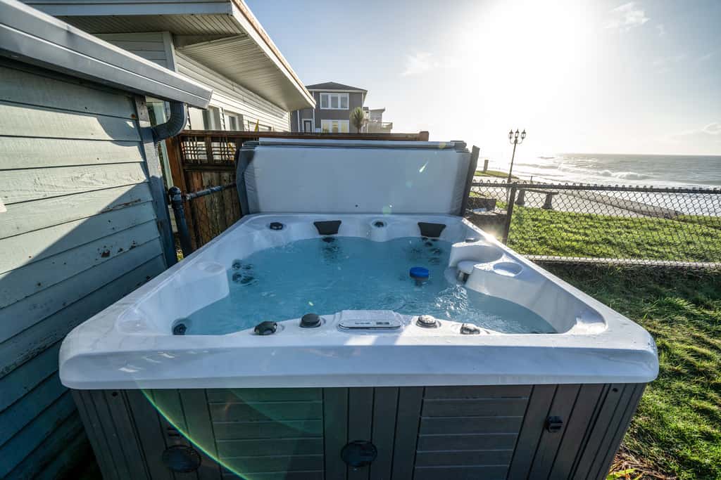 Oceanfront house steps to beach with private hot tub firepit and spectacular view