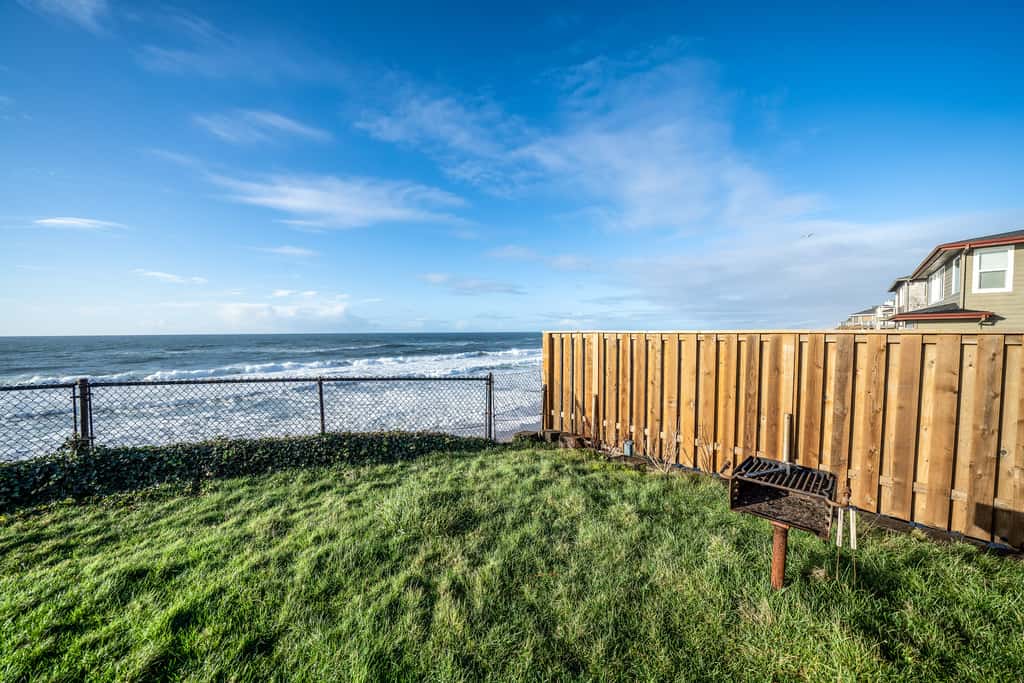 Oceanfront house steps to beach with private hot tub firepit and spectacular view