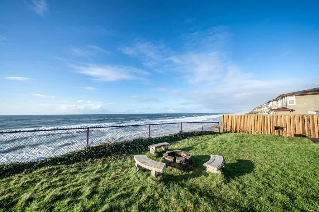 Oceanfront house steps to beach with private hot tub firepit and spectacular view