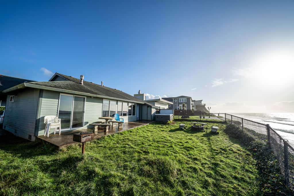 Oceanfront house steps to beach with private hot tub firepit and spectacular view