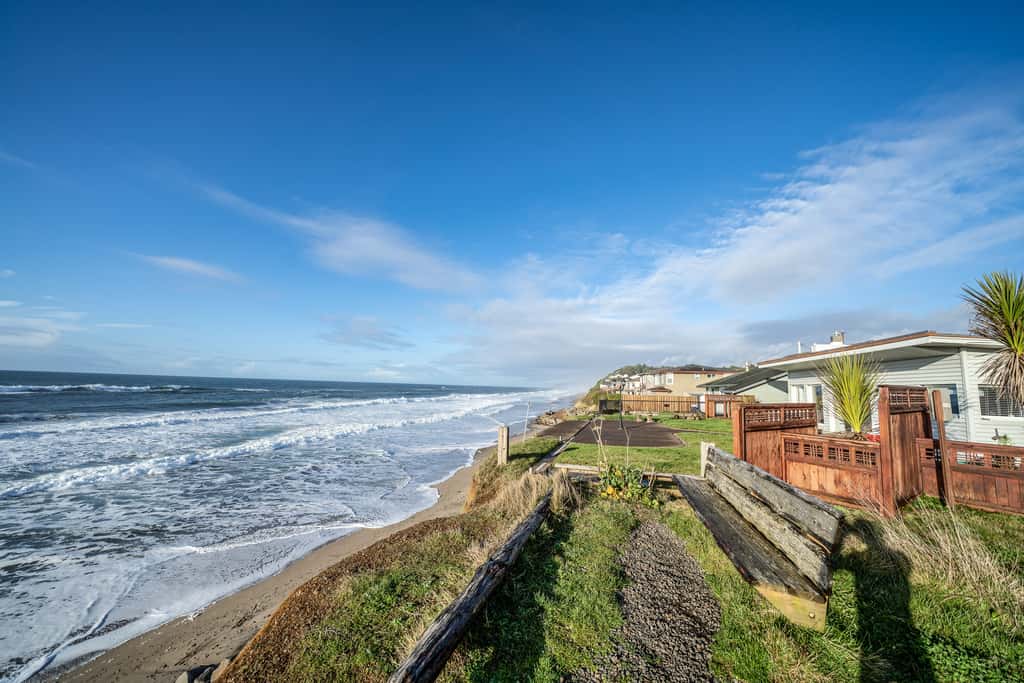Oceanfront house steps to beach with private hot tub firepit and spectacular view