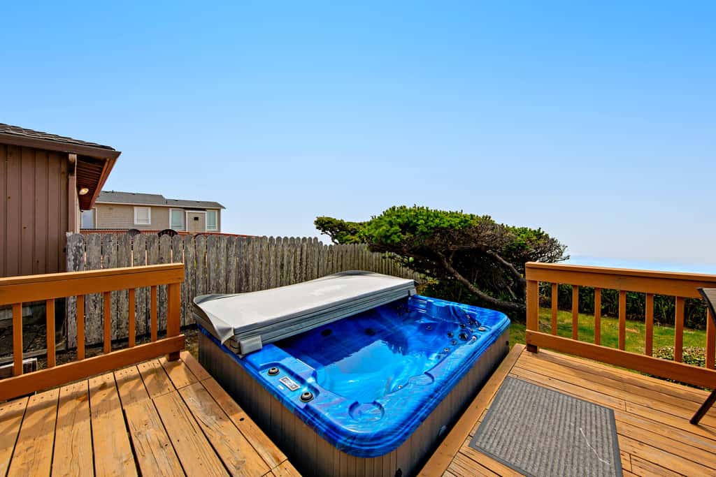 Oceanfront dog friendly house with deck private hot tub and stunning views