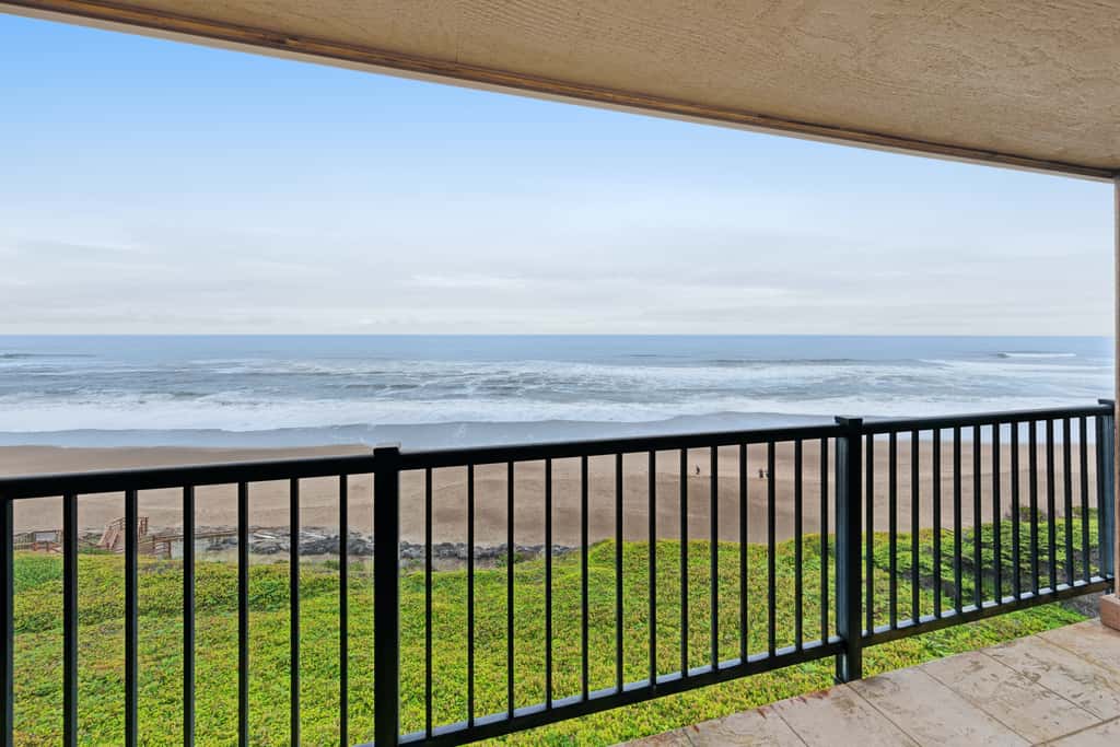 Lovely oceanfront condo with sweeping water views and balcony
