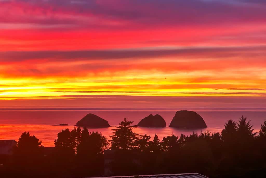 Sweeping ocean view home with fireplace grill and foosball table dog friendly