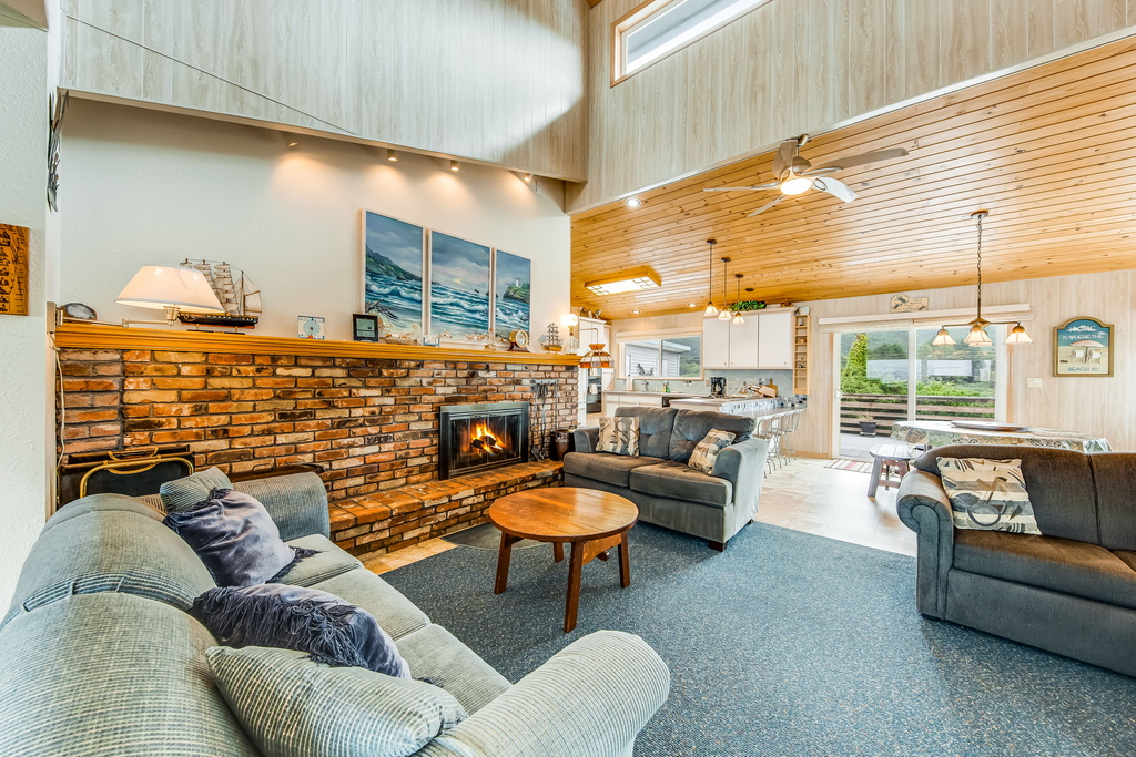 Spacious family home with ocean view balcony deck and fireplace dogs OK