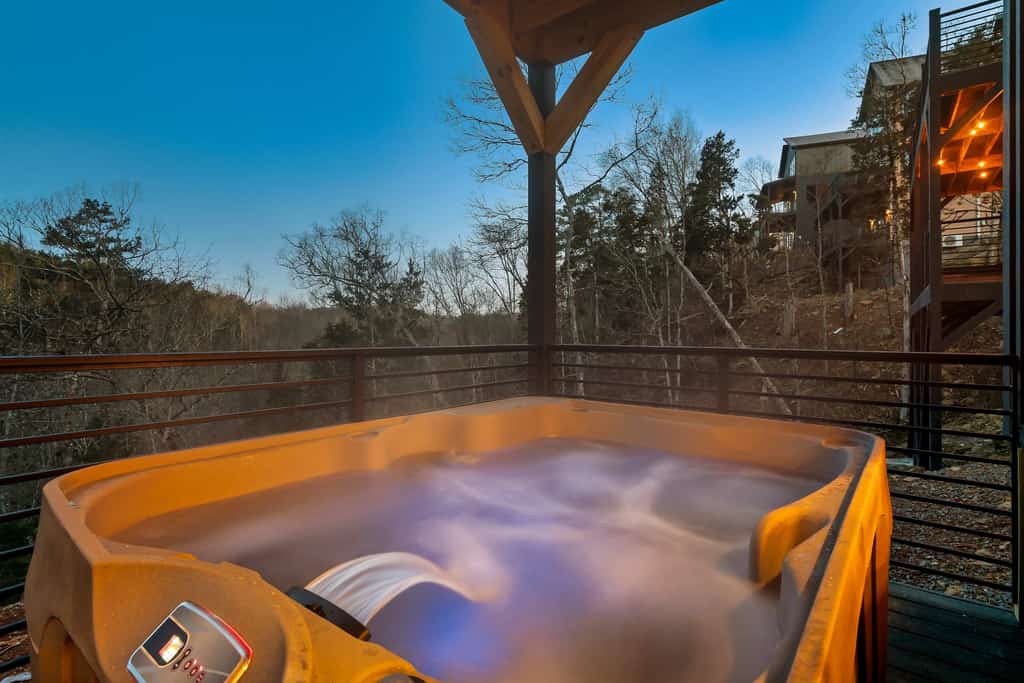 Private heated pool, hot tub, and great location. This luxurious 5-bedroom cabin, nestled in the mountains, offers unmatched elegance and is just minutes from top attractions.  A fireplace and plush furnishings create a cozy living area. Enjoy the fully equipped kitchen, and rest easy in bedrooms designed for ultimate comfort.. A perfect blend of tranquility and access to nearby adventures. Welcome to the Smokies!