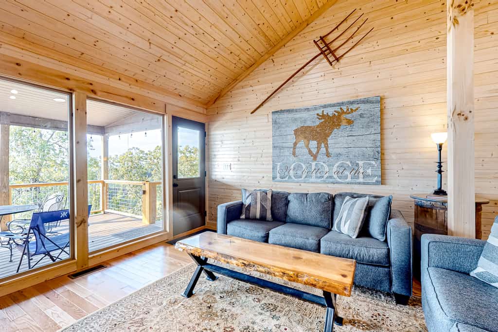 Lakefront Douglas Lake retreat in Dandridge, TN with 2 covered decks, lake views, a game room, and easy access to fishing, boating, and Smoky Mountain attractions.