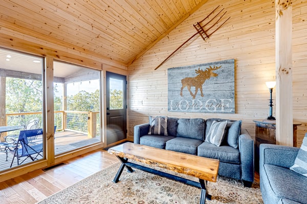 Lakefront Douglas Lake retreat in Dandridge, TN with 2 covered decks, lake views, a game room, and easy access to fishing, boating, and Smoky Mountain attractions.