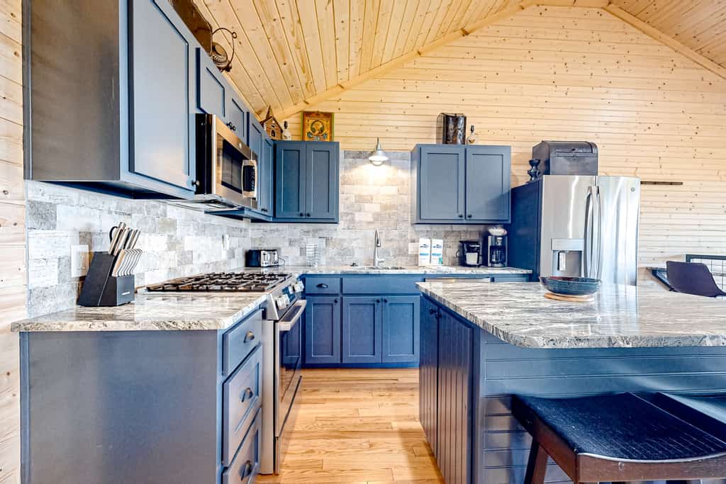 Lakefront Douglas Lake retreat in Dandridge, TN with 2 covered decks, lake views, a game room, and easy access to fishing, boating, and Smoky Mountain attractions.