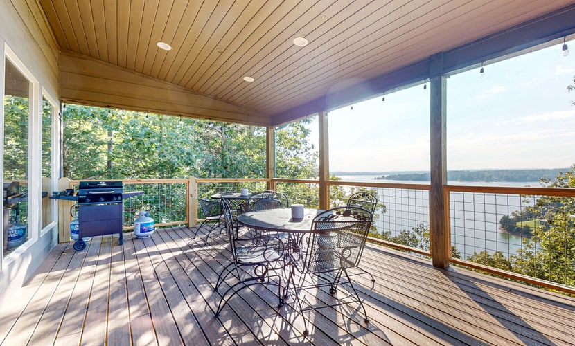 Lakefront Douglas Lake retreat in Dandridge, TN with 2 covered decks, lake views, a game room, and easy access to fishing, boating, and Smoky Mountain attractions.