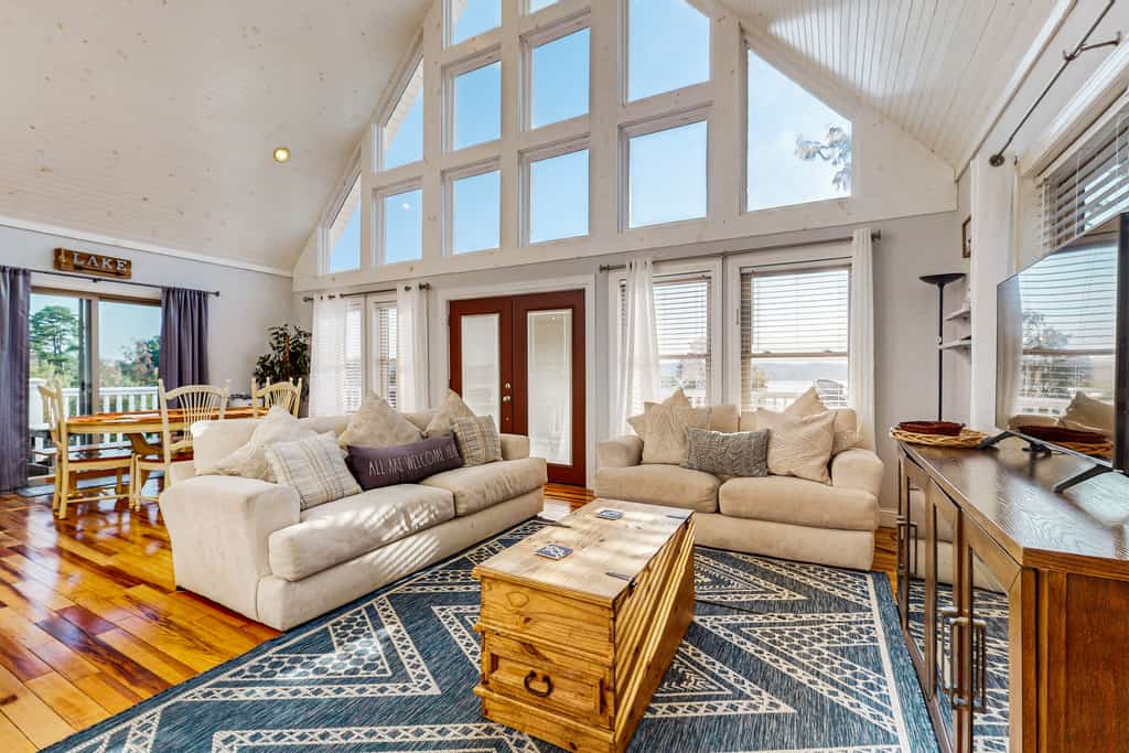 Escape to a spacious 3-bedroom, 3-bath lakefront home on Douglas Lake, perfect for families and groups up to 10. Enjoy a private dock, kayaks, paddle board, hot tub, wrap-around deck, fire pit, lake and sunset views, ping-pong, Smart TVs, fast WiFi, and a fully equipped kitchen. Conveniently located for exploring Dandridge, Sevierville, Pigeon Forge, Dollywood, and the Smoky Mountains.
