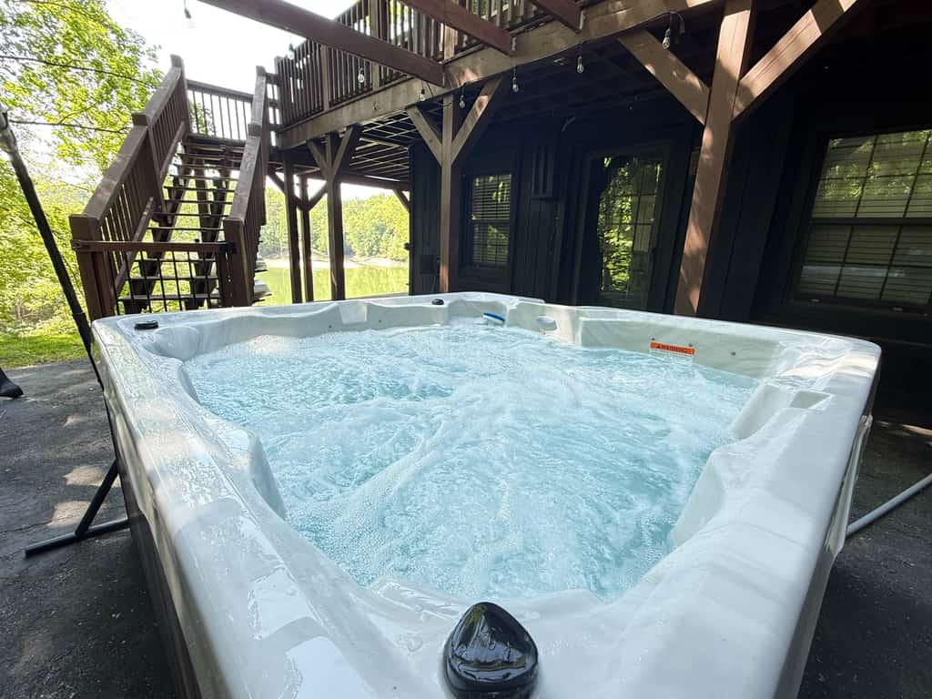 Douglas Haus is a lakefront cabin in Dandridge, TN featuring a private dock, hot tub, kayaks, lake views, mountain scenery, and comfortable accommodations for families and groups. Enjoy direct lake access, outdoor relaxation, a fire pit, gas grill, ping-pong, and peaceful East Tennessee surroundings.