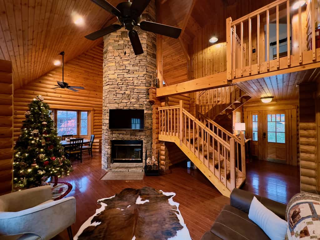 Escape to 4 Pines Lodge, a cozy 2-bedroom Gatlinburg cabin with beautiful Smoky Mountain views, two king bedrooms, and room for up to 6 guests! Relax in the private hot tub, cozy up by the wood-burning fireplace, or enjoy your morning coffee on the spacious 40-foot deck. Small dogs are welcome, too! Nestled in Cobbly Nob Resort, enjoy seasonal community pools, pickleball, nearby golf, and easy access to Gatlinburg and the Great Smoky Mountains.
