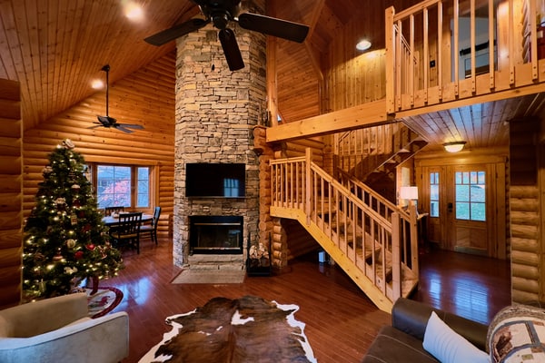 Escape to 4 Pines Lodge, a cozy 2-bedroom Gatlinburg cabin with beautiful Smoky Mountain views, two king bedrooms, and room for up to 6 guests! Relax in the private hot tub, cozy up by the wood-burning fireplace, or enjoy your morning coffee on the spacious 40-foot deck. Small dogs are welcome, too! Nestled in Cobbly Nob Resort, enjoy seasonal community pools, pickleball, nearby golf, and easy access to Gatlinburg and the Great Smoky Mountains.