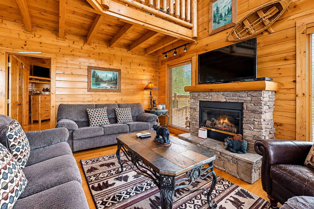 Our 2 bedroom, 3 bathroom Smoky Mountain cabin pairs big Wears Valley views with a three-level layout and plenty of room to unwind.

・Private deck with mountain scenery and outdoor seating
・Pool table, foosball, and fireplace for easy downtime
・Full kitchen plus dining space for shared meals
・3.5 miles from Pigeon Forge
・9.1 miles from Great Smoky Mountains National Park

Settle in, unplug from Wi‑Fi, and enjoy a classic cabin escape with room to breathe.