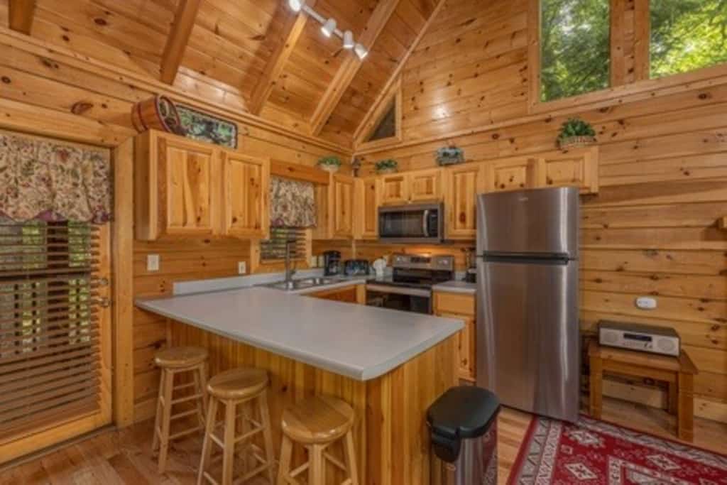 Stay in a cozy one-bedroom log cabin at Eagles Ridge Resort, conveniently located about a mile from the Pigeon Forge Parkway and less than 5 miles from Dollywood. Sleeping up to 4 guests, this retreat features a private hot tub, pool table, in-room jacuzzi, gas fireplace, fully equipped kitchen, gas grill, and two spacious porches. Enjoy easy access to local attractions and dining, then return to a peaceful cabin setting where you can relax and unwind.