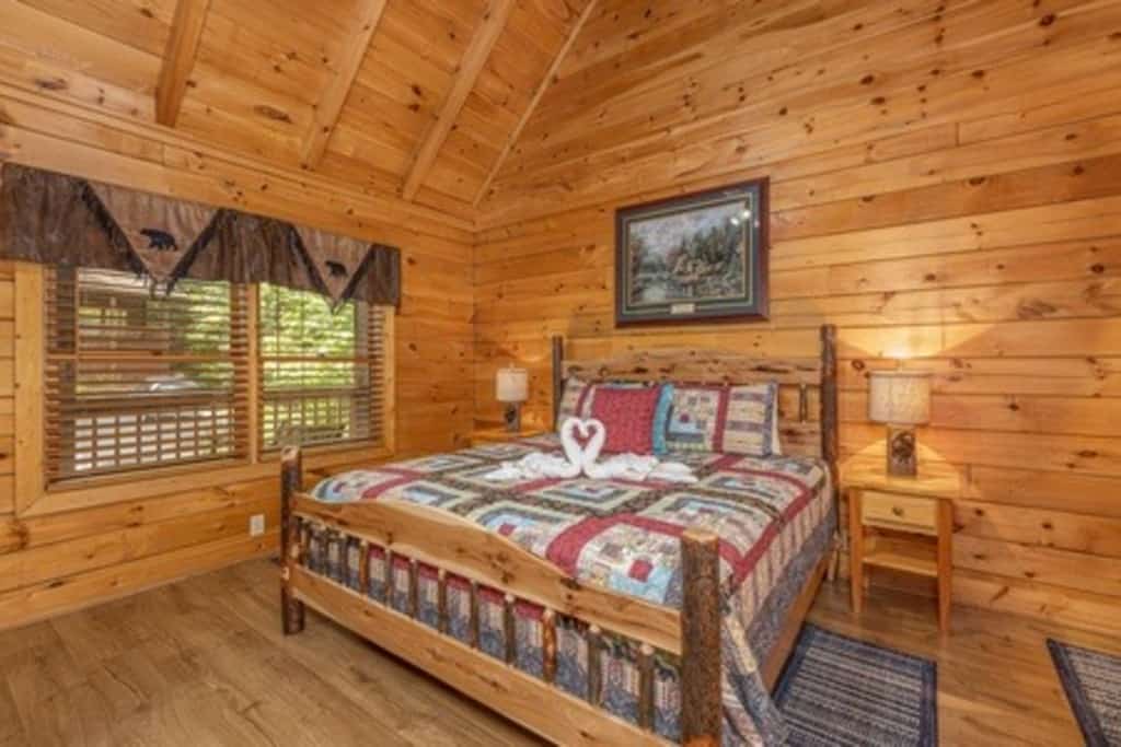 Stay in a cozy one-bedroom log cabin at Eagles Ridge Resort, conveniently located about a mile from the Pigeon Forge Parkway and less than 5 miles from Dollywood. Sleeping up to 4 guests, this retreat features a private hot tub, pool table, in-room jacuzzi, gas fireplace, fully equipped kitchen, gas grill, and two spacious porches. Enjoy easy access to local attractions and dining, then return to a peaceful cabin setting where you can relax and unwind.