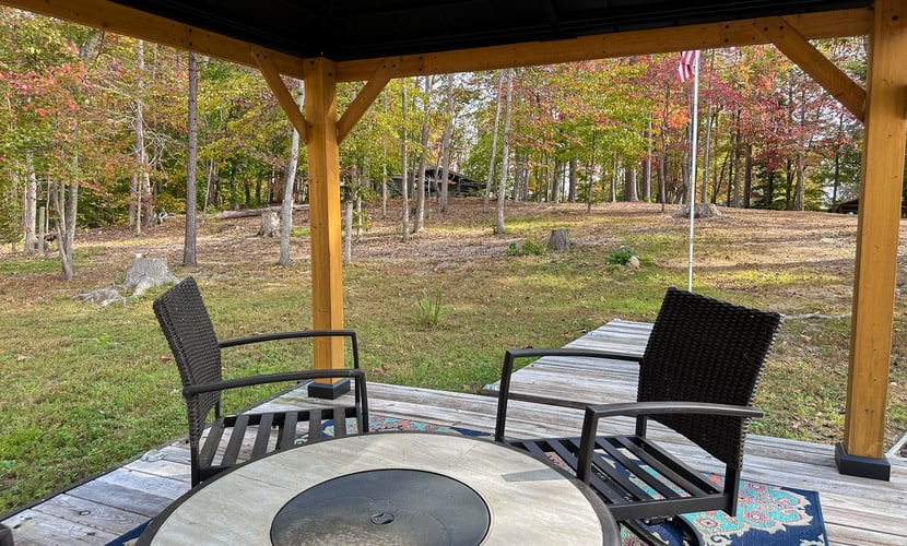 Escape to a lakefront Norris Lake cabin in Sharps Chapel, Tennessee, with 3 bedrooms, 2 bathrooms, a private seasonal dock with boat slip, covered deck, firepit, grill, smoker, and cozy fireplace. Perfect for family lake vacations, boating, fishing, and peaceful East Tennessee getaways.