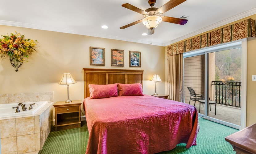 2BR/2BA downtown Gatlinburg condo sleeping 8 with mountain views, private balconies, seasonal pool, hot tub, fireplace, and easy walking access to top attractions, dining, hiking, and Ober Gatlinburg.
