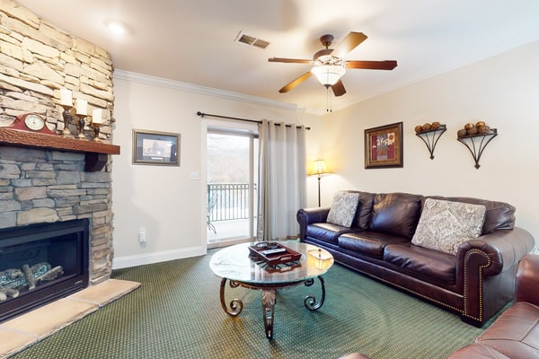 Stay at Summit Manor Condos, just two blocks from downtown Gatlinburg. This 2-bedroom, 2-bath condo sleeps 6 and features mountain views, two private balconies, a gas fireplace, a fully equipped kitchen, free Wi-Fi, and free onsite parking. Enjoy downtown shops, restaurants, and attractions, then unwind in the shared hot tub or seasonal community pool. An ideal base for exploring the Smoky Mountains.