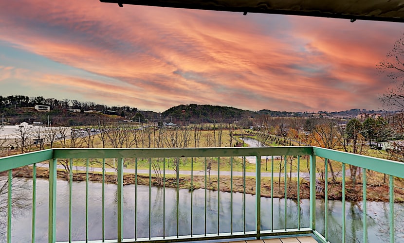 Stay at River Place Condos in Pigeon Forge, a 2BR/2BA riverside retreat for up to 4 guests. Enjoy two en-suite bedrooms, a private balcony with Little Pigeon River and mountain views, gas fireplace, full kitchen, Wi-Fi, washer/dryer, and seasonal pool. Walk to Patriot Park and the Old Mill, with Dollywood, The Island, LeConte Center, dining, and Great Smoky Mountains attractions nearby.