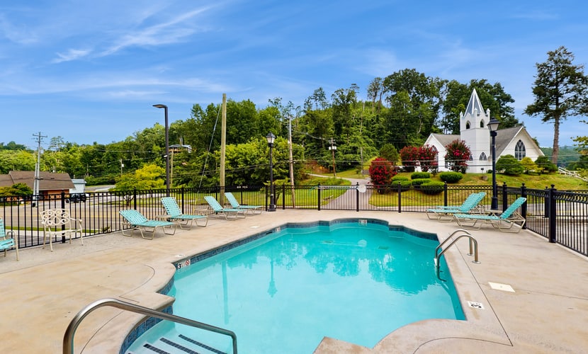 Stay in a spacious 2-bedroom, 2-bathroom Gatlinburg condo with mountain views, a private balcony, seasonal pool, full kitchen, and wood-burning fireplace. Located 2.3 miles from Downtown Gatlinbu