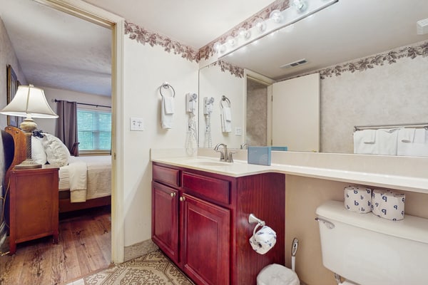 Stay in a spacious 2-bedroom, 2-bathroom Gatlinburg condo with mountain views, a private balcony, seasonal pool, full kitchen, and wood-burning fireplace. Located 2.3 miles from Downtown Gatlinbu