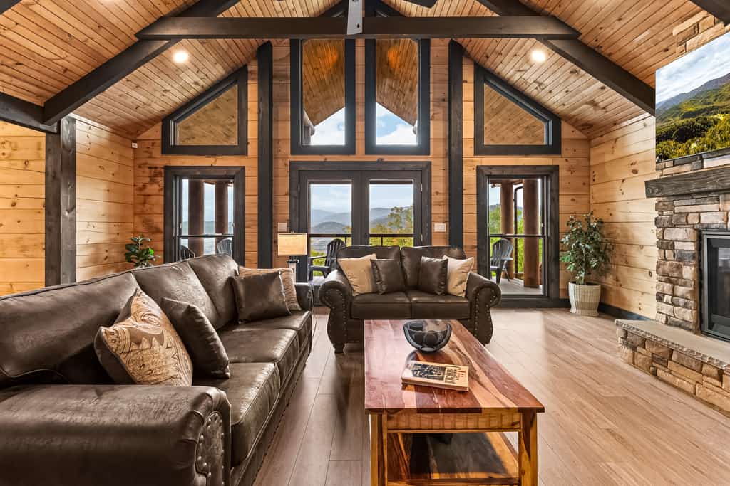 Welcome to this 3-bedroom, 3-bathroom Smoky Mountain cabin in Sevierville, Tennessee, sleeping up to 9 guests. Enjoy wraparound decks with mountain and valley views, a private fitness room, gas fireplace, spacious living areas, a fully equipped kitchen, and private outdoor space. With Great Smoky Mountains National Park just 9.2 miles away, this cabin makes a comfortable home base for family vacations, group getaways, hiking, sightseeing, and exploring Pigeon Forge, Gatlinburg, and Dollywood.