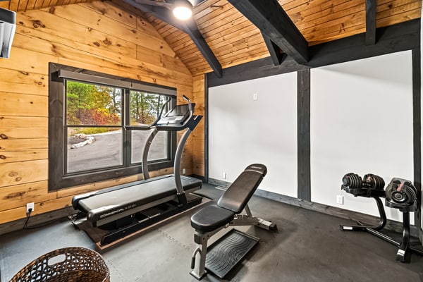 Welcome to this 3-bedroom, 3-bathroom Smoky Mountain cabin in Sevierville, Tennessee, sleeping up to 9 guests. Enjoy wraparound decks with mountain and valley views, a private fitness room, gas fireplace, spacious living areas, a fully equipped kitchen, and private outdoor space. With Great Smoky Mountains National Park just 9.2 miles away, this cabin makes a comfortable home base for family vacations, group getaways, hiking, sightseeing, and exploring Pigeon Forge, Gatlinburg, and Dollywood.