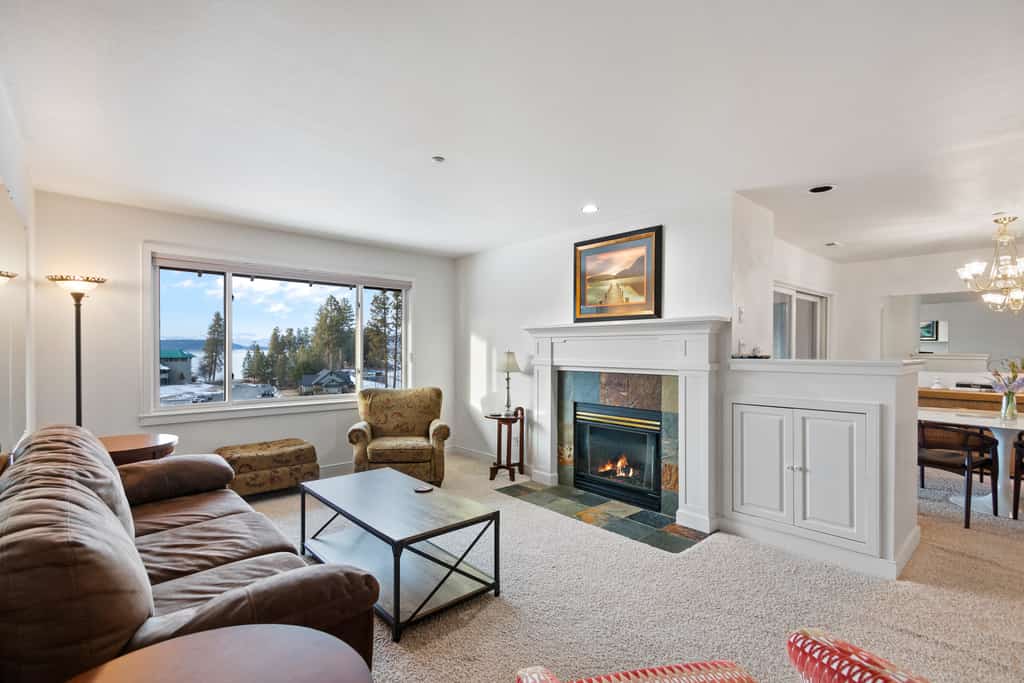 Your lakeside stay starts here, with a modern single-level condo overlooking Lake Coeur d’Alene. Take in beautiful lake and mountain views from the private balcony, or enjoy the indoor pool and direct beach access. The 2-bedroom, 2-bathroom condo also features a fully equipped kitchen, cozy fireplace, dining space, and BBQ grill—plus a prime location next to Gozzer Ranch.