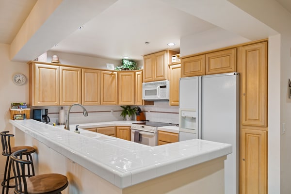 Your lakeside stay starts here, with a modern single-level condo overlooking Lake Coeur d’Alene. Take in beautiful lake and mountain views from the private balcony, or enjoy the indoor pool and direct beach access. The 2-bedroom, 2-bathroom condo also features a fully equipped kitchen, cozy fireplace, dining space, and BBQ grill—plus a prime location next to Gozzer Ranch.