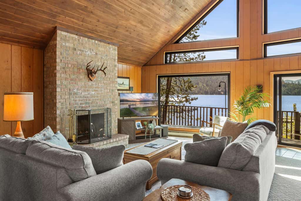 Tucked among the trees along the western shore of Lake Coeur d’Alene, this private cabin offers a true escape from the everyday. The 4-bedroom, 2-bathroom home accommodates up to 8 guests, with plenty of space to gather, unwind, and enjoy the lake. Spend your days kayaking from the private dock, relaxing on the deck, or enjoying a meal outdoors before settling in for a cozy evening by the fireplace.