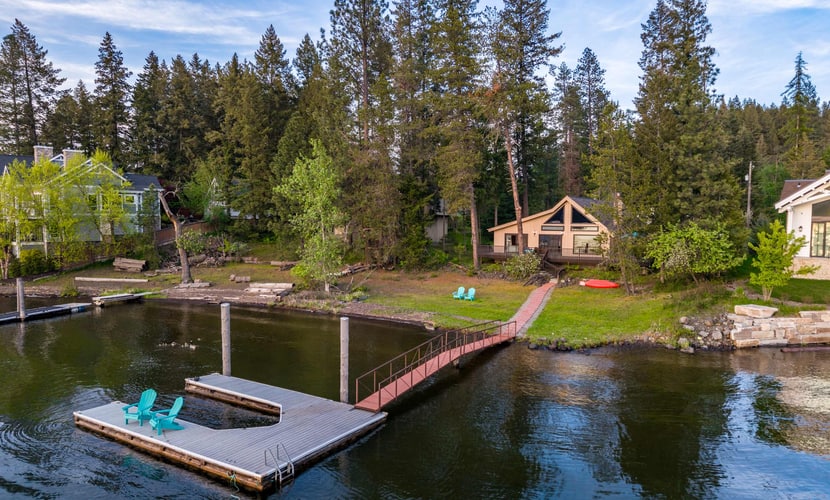 Tucked among the trees along the western shore of Lake Coeur d’Alene, this private cabin offers a true escape from the everyday. The 4-bedroom, 2-bathroom home accommodates up to 8 guests, with plenty of space to gather, unwind, and enjoy the lake. Spend your days kayaking from the private dock, relaxing on the deck, or enjoying a meal outdoors before settling in for a cozy evening by the fireplace.