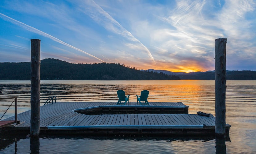 Tucked among the trees along the western shore of Lake Coeur d’Alene, this private cabin offers a true escape from the everyday. The 4-bedroom, 2-bathroom home accommodates up to 8 guests, with plenty of space to gather, unwind, and enjoy the lake. Spend your days kayaking from the private dock, relaxing on the deck, or enjoying a meal outdoors before settling in for a cozy evening by the fireplace.