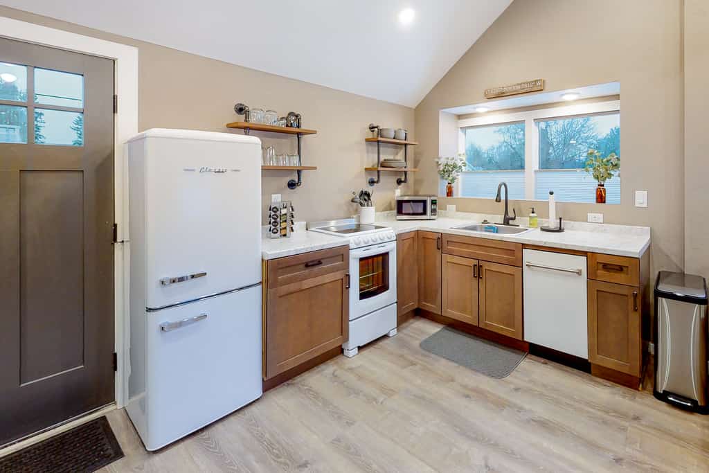 Wake up downtown, wander to the lake, and end the evening around your own backyard fire pit — all from this charming single-level bungalow.