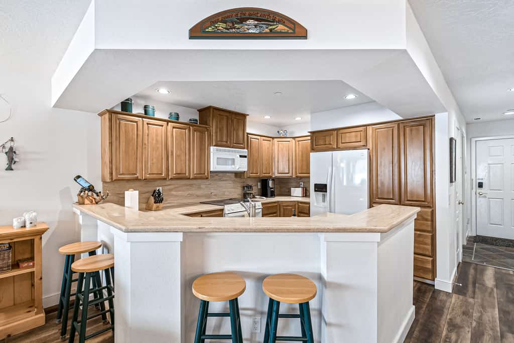 Wake up to beautiful lake and mountain views from this peaceful waterfront condo on Lake Coeur d’Alene. Enjoy your private balcony with dining space and a grill, sandy beach access, and an indoor pool. Inside, the bright 1,250 sq ft home features an open kitchen and living area, creating a comfortable space to relax after a day of adventure. About 30 minutes from downtown Coeur d’Alene, it’s a perfect getaway for couples, families, and outdoor enthusiasts.