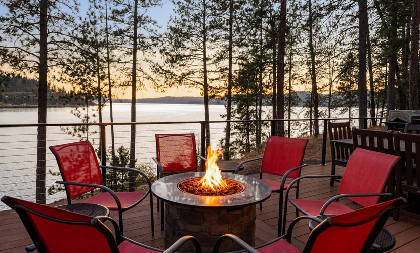 Escape to a luxurious lakefront retreat on a private point of Lake Coeur d’Alene. Enjoy stunning sunset views, direct shoreline access, a private dock, and an expansive deck with a grill and fire table. Inside, unwind in a beautifully designed 3-bedroom, 3-bathroom home featuring a gourmet kitchen, cozy fireplace, and inviting spaces for up to 8 guests. Peaceful, private, and perfect for unforgettable lake days.