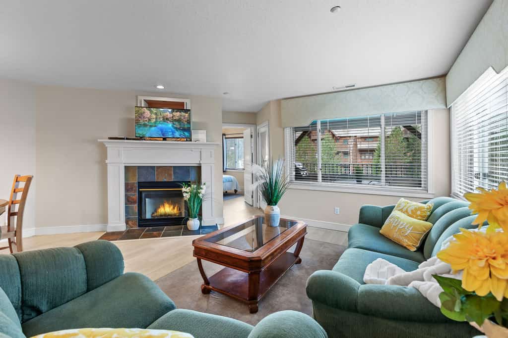 Escape to a stunning waterfront condo! Enjoy breathtaking mountain and lake views from your private balcony. This family-friendly retreat offers lake access, a public beach, and is perfect for water sports. With three bedrooms, two bathrooms, and modern amenities, it's the ideal getaway for families and friends seeking relaxation and adventure.