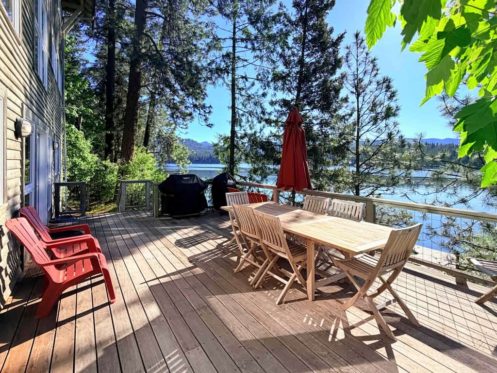 Escape to a stunning lakefront house offering breathtaking mountain and water views. Enjoy a spacious home with a private dock, perfect for swimming, fishing, or simply soaking up the sun. Relax by the indoor wood fireplace or on the outdoor patio, and explore nearby attractions like the lake, trails, and surrounding nature.