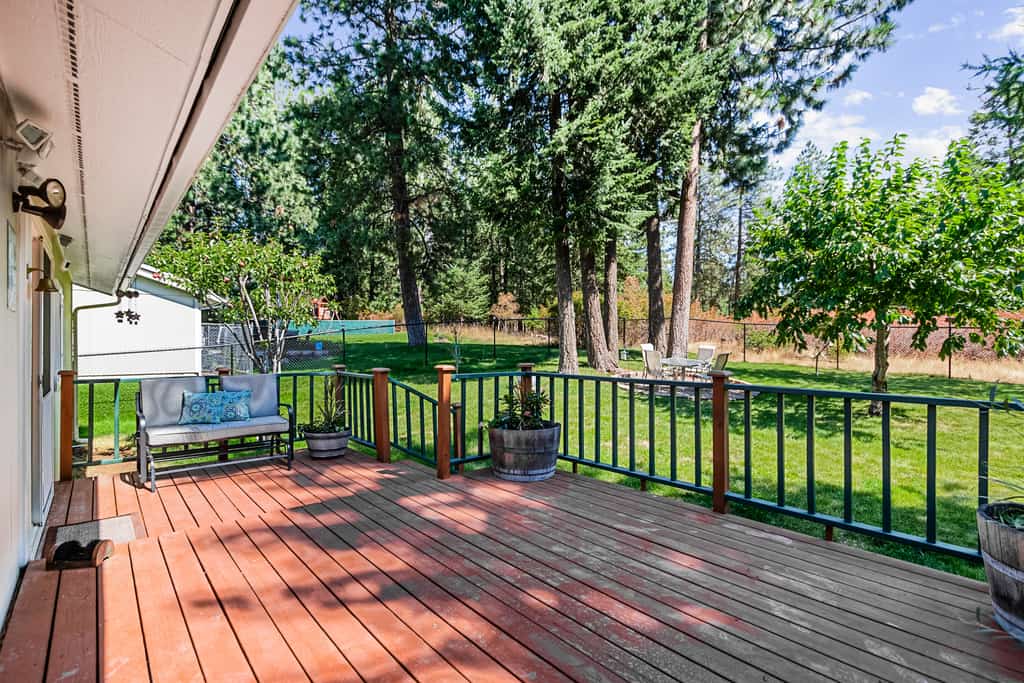Wake up above the treetops with sweeping views of Hayden Lake and the mountains beyond. This inviting 2-bedroom, 2-bath home sleeps up to 7 and offers a fully equipped kitchen, comfortable living space, Smart TV, foosball, and two private decks. Spend the day exploring nearby lake activities or Silverwood, then come home to BBQ dinners and relaxing evenings in the fenced yard.