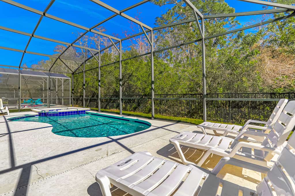 Colorful home with pool, patio, kitchen, washer/dryer, & game room