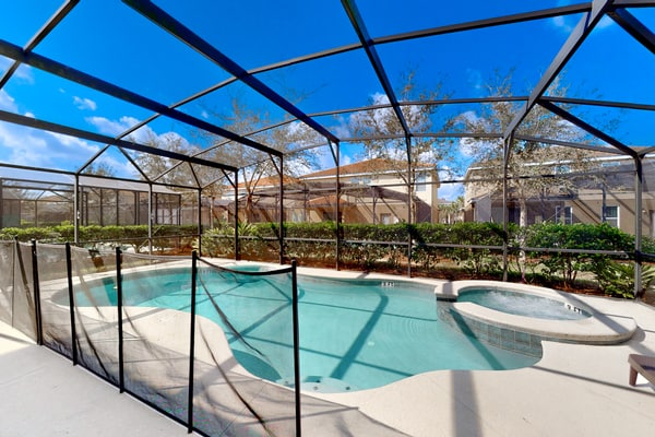 Gated-entry townhome with private pool, patio, game room, AC, & W/D