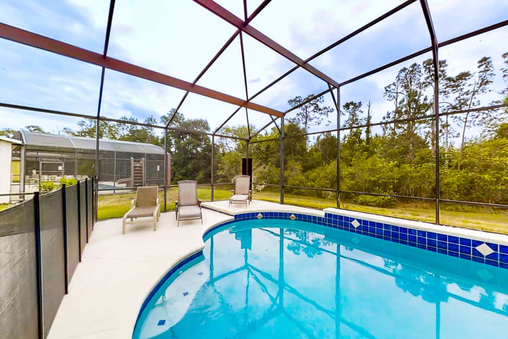Sprawling home with pool, pool spa, & game room - athletic court and gym access