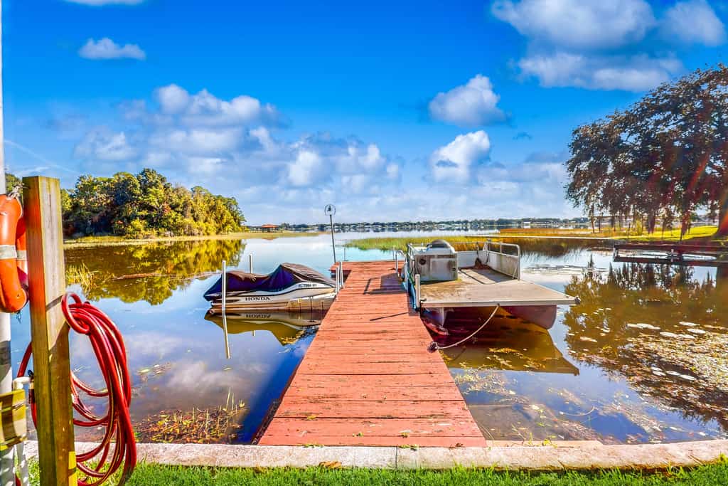 Lakefront home with water views, foosball, screened porch, & private W/D
