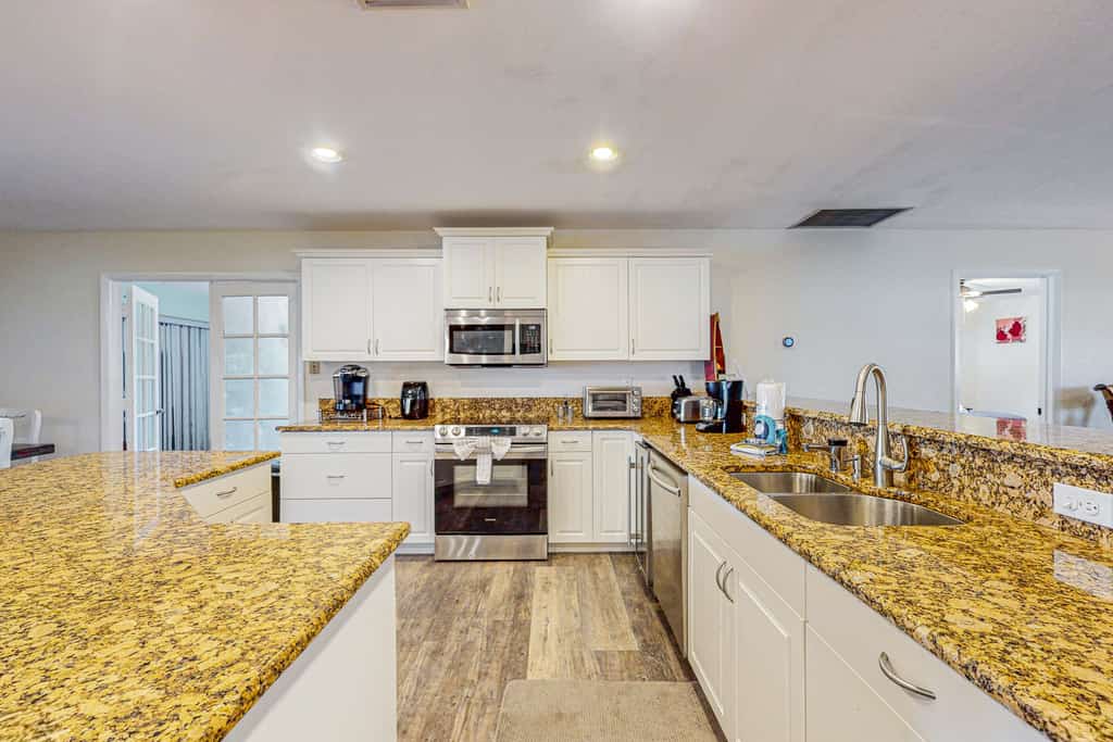 Lakefront home with water views, foosball, screened porch, & private W/D