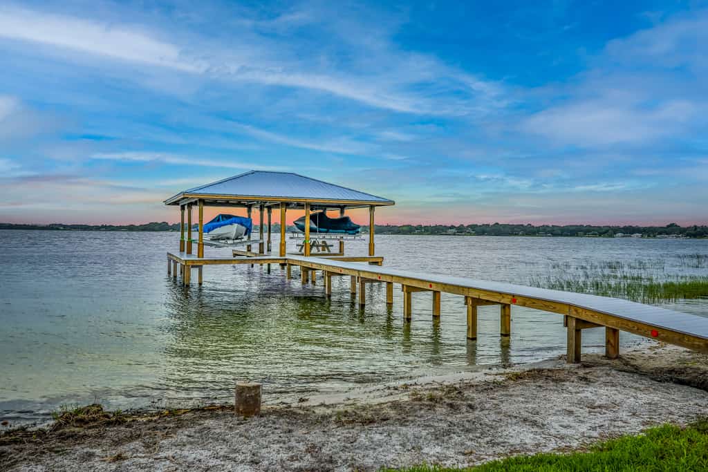 Dog-friendly lakefront home with fast WiFi, central AC, patio, & game room