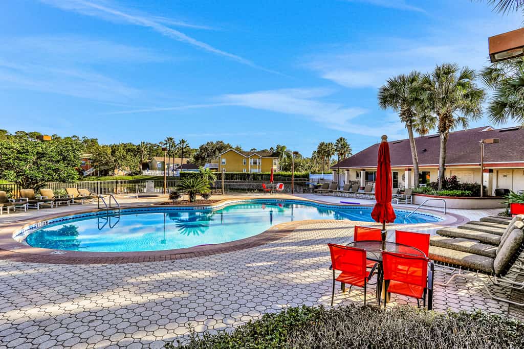Breezy townhouse with a pool, hot tub, patio, central AC, and washer/dryer